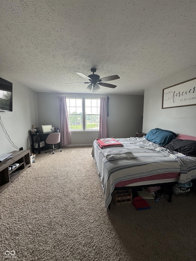 6027 Moonseed Cir, Indianapolis, IN 46203 - bedroom featuring carpet flooring, ceiling fan, a textured ceiling, and an office area