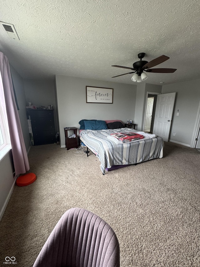 6027 Moonseed Cir, Indianapolis, IN 46203 - carpeted bedroom featuring a ceiling fan and a textured ceiling
