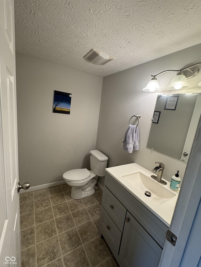 6027 Moonseed Cir, Indianapolis, IN 46203 - bathroom featuring vanity, a textured ceiling, and tile patterned flooring
