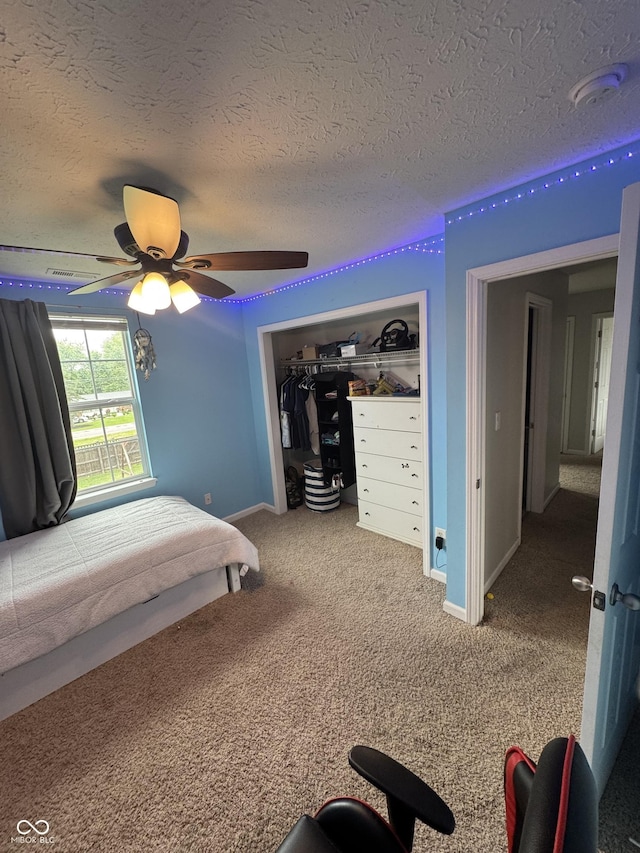 6027 Moonseed Cir, Indianapolis, IN 46203 - carpeted bedroom with ceiling fan, a textured ceiling, and a closet