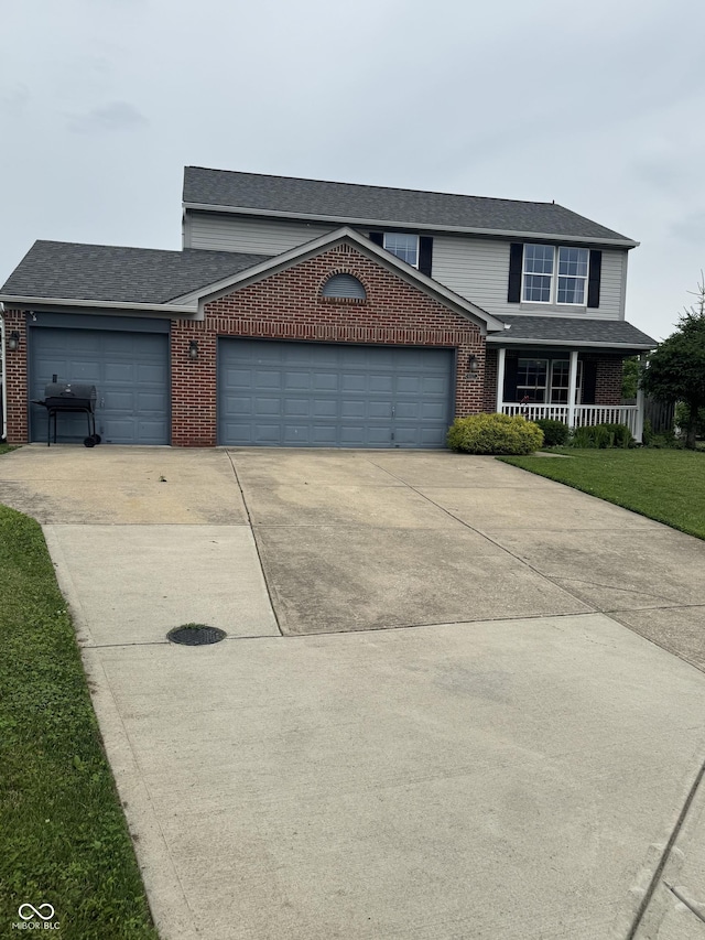 6027 Moonseed Cir, Indianapolis, IN 46203 - traditional home with brick siding, concrete driveway, a garage, a porch, and a shingled roof
