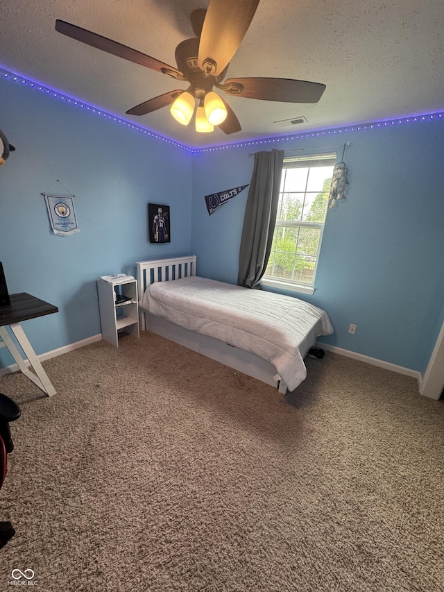 6027 Moonseed Cir, Indianapolis, IN 46203 - bedroom with carpet flooring, a textured ceiling, and ceiling fan