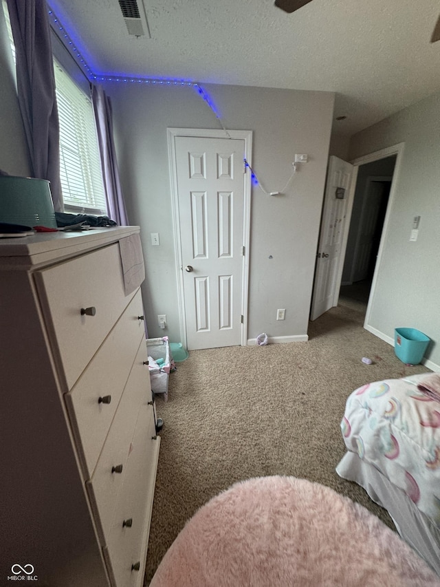 6027 Moonseed Cir, Indianapolis, IN 46203 - carpeted bedroom featuring baseboards and a textured ceiling
