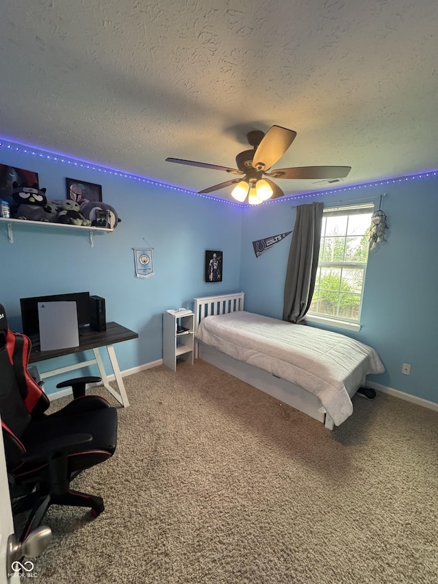 6027 Moonseed Cir, Indianapolis, IN 46203 - bedroom with a textured ceiling, an office area, carpet floors, and ceiling fan