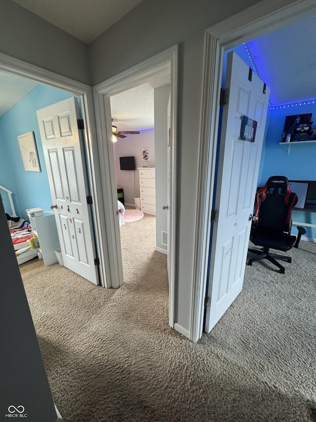 6027 Moonseed Cir, Indianapolis, IN 46203 - hallway with carpet flooring and an office area