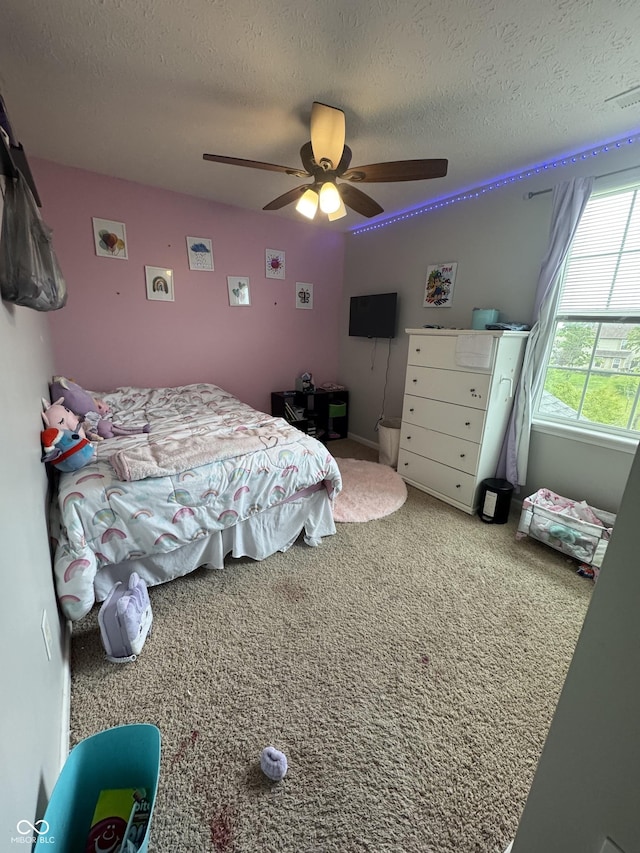 6027 Moonseed Cir, Indianapolis, IN 46203 - bedroom featuring a textured ceiling, a ceiling fan, and carpet flooring