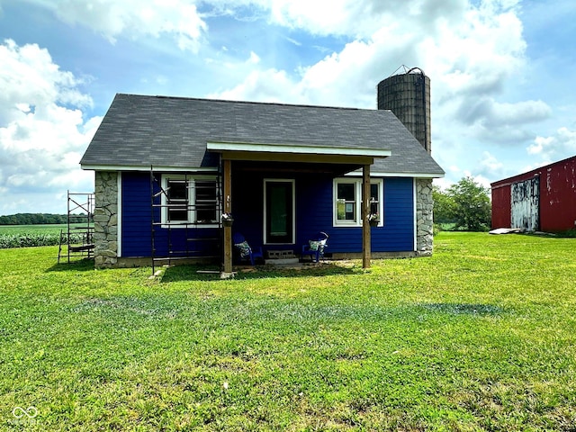 1842 S 850 E, Crawfordsville, IN 47933 - view of front of house with stone siding, a chimney, and a front yard