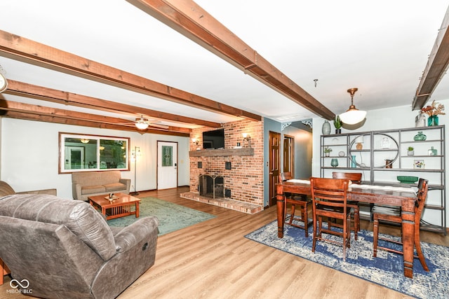 1624 Riley Rd, Lebanon, IN 46052 - living area featuring wood finished floors, beam ceiling, a fireplace, and a ceiling fan