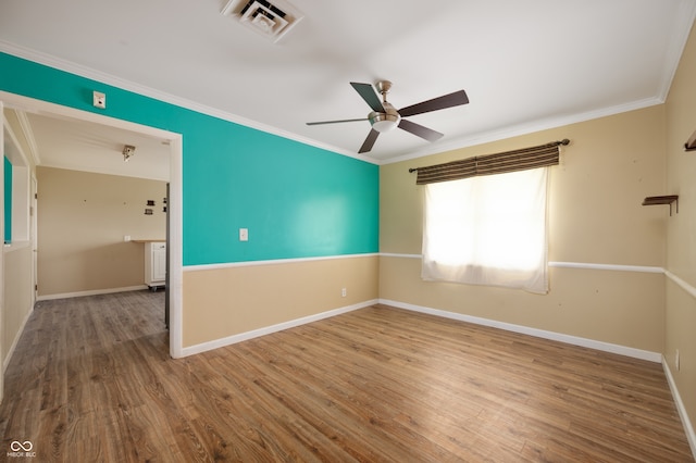 10500 S County Road 200 W, Muncie, IN 47302 - empty room featuring crown molding, wood finished floors, and a ceiling fan