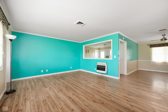 10500 S County Road 200 W, Muncie, IN 47302 - unfurnished living room with heating unit, crown molding, wood finished floors, and a ceiling fan