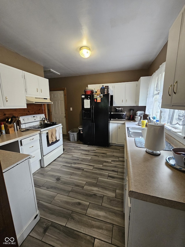 2824 Brown St, Anderson, IN 46016 - kitchen featuring electric range, black fridge with ice dispenser, under cabinet range hood, and white cabinetry