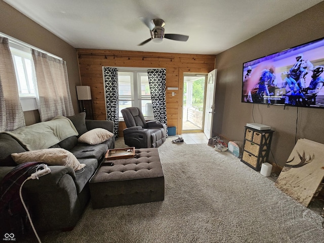 2824 Brown St, Anderson, IN 46016 - living room with wood walls, plenty of natural light, carpet, and ceiling fan