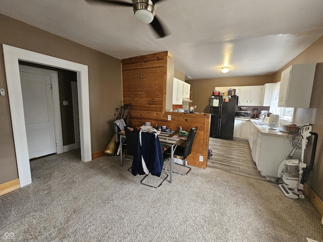 2824 Brown St, Anderson, IN 46016 - dining room featuring ceiling fan and light carpet