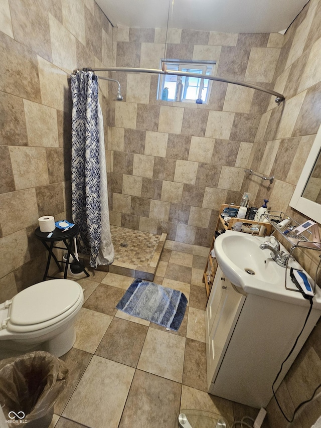 2824 Brown St, Anderson, IN 46016 - bathroom with a stall shower, vanity, and tile walls