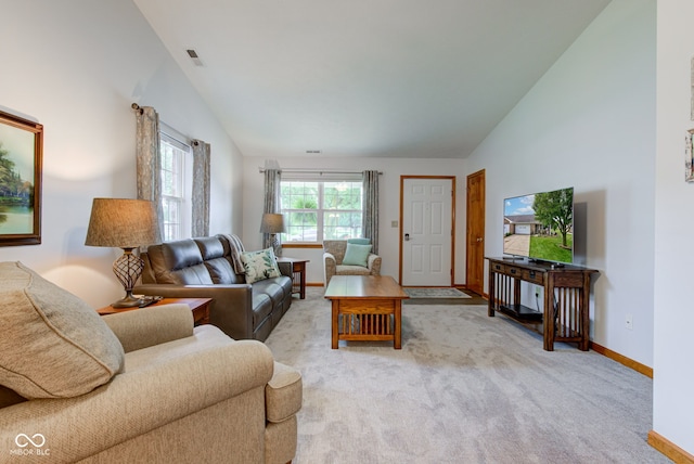 7911 Bentley Commons Dr, Indianapolis, IN 46259 - living room featuring lofted ceiling and light carpet
