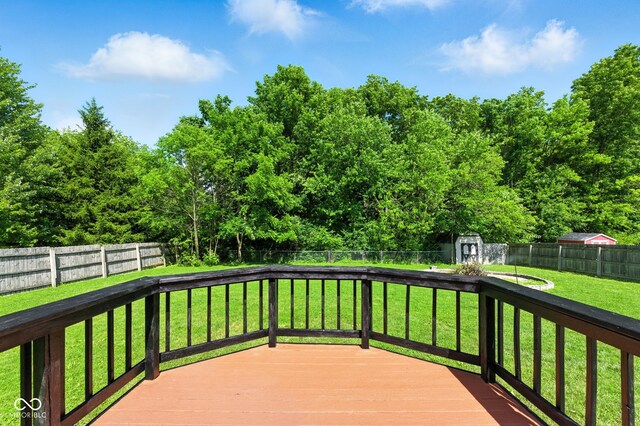 9265 Brunson Run, Indianapolis, IN 46256 - wooden deck featuring a fenced backyard and a storage unit