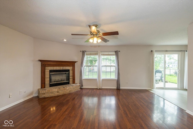 14523 Lee Stewart Ln, Fishers, IN 46038 - unfurnished living room with a ceiling fan, wood finished floors, and a brick fireplace