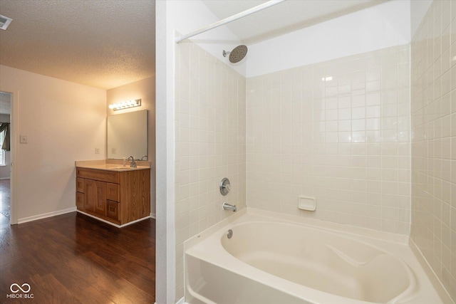 14523 Lee Stewart Ln, Fishers, IN 46038 - full bath with wood finished floors, bathtub / shower combination, vanity, and a textured ceiling