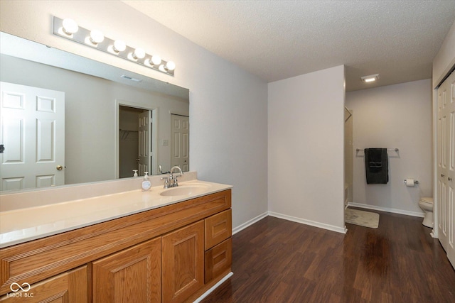 14523 Lee Stewart Ln, Fishers, IN 46038 - bathroom featuring wood finished floors, vanity, and a textured ceiling