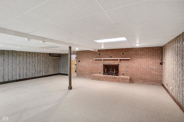 7165 W State Road 252nd Rd W, Edinburgh, IN 46124 - finished basement featuring a drop ceiling, carpet floors, brick wall, and wooden walls