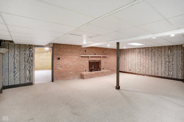 7165 W State Road 252nd Rd W, Edinburgh, IN 46124 - finished basement with a paneled ceiling, wood walls, carpet, brick wall, and a dry bar