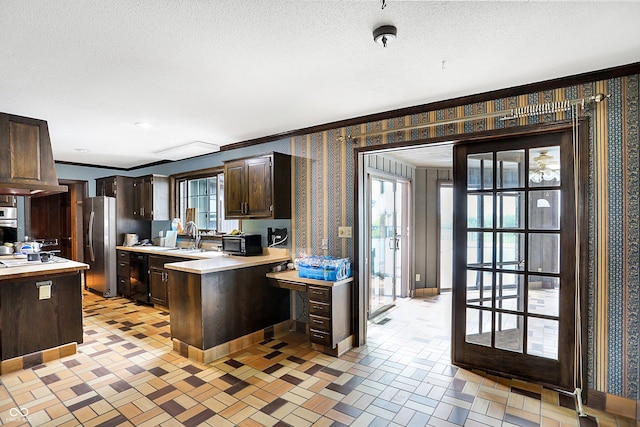 7165 W State Road 252nd Rd W, Edinburgh, IN 46124 - kitchen featuring light countertops, dark brown cabinets, wallpapered walls, black appliances, and ornamental molding