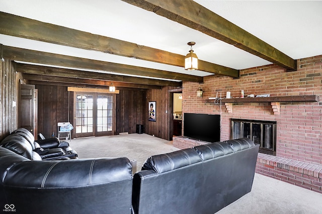 7165 W State Road 252nd Rd W, Edinburgh, IN 46124 - living room featuring carpet floors, wooden walls, beamed ceiling, and a brick fireplace