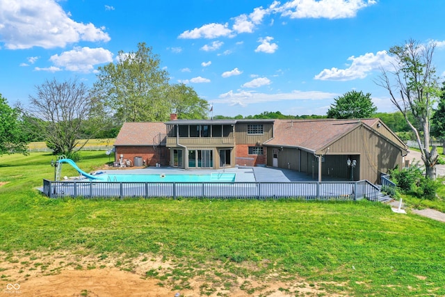 7165 W State Road 252nd Rd W, Edinburgh, IN 46124 - rear view of property featuring a lawn, a chimney, a patio, and a balcony