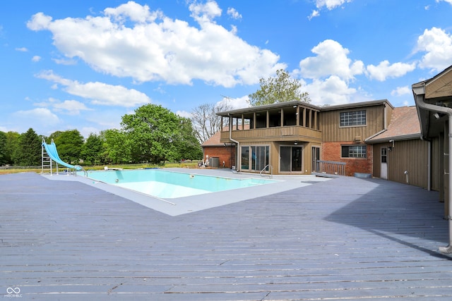 7165 W State Road 252nd Rd W, Edinburgh, IN 46124 - view of swimming pool with a water slide, a wooden deck, and an empty pool