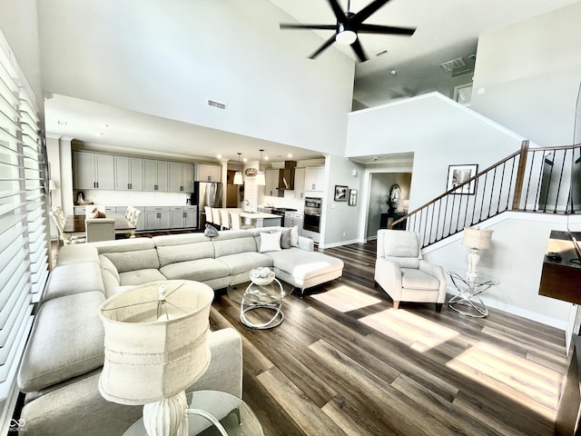 4281 Viewforth Ln, Bargersville, IN 46106 - living area featuring dark wood finished floors, a high ceiling, a ceiling fan, and stairway