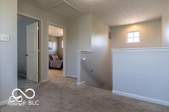 12584 Cold Stream Rd, Noblesville, IN 46060 - hall with an upstairs landing, carpet flooring, and attic access