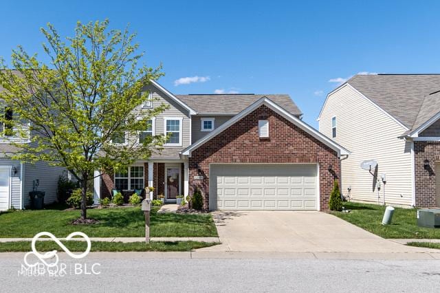 12584 Cold Stream Rd, Noblesville, IN 46060 - traditional home with an attached garage, brick siding, and a front yard