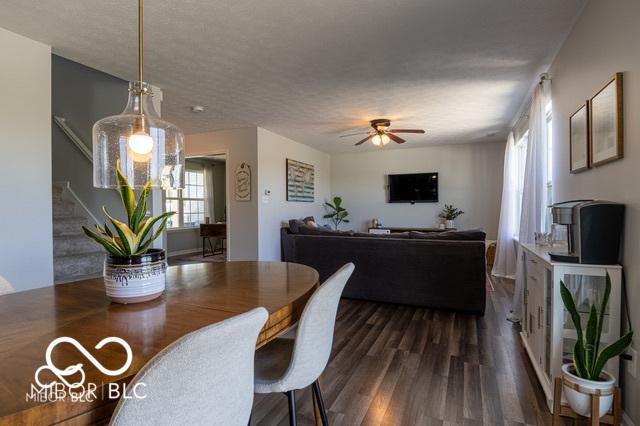 12584 Cold Stream Rd, Noblesville, IN 46060 - dining space with dark wood-type flooring, stairs, and ceiling fan
