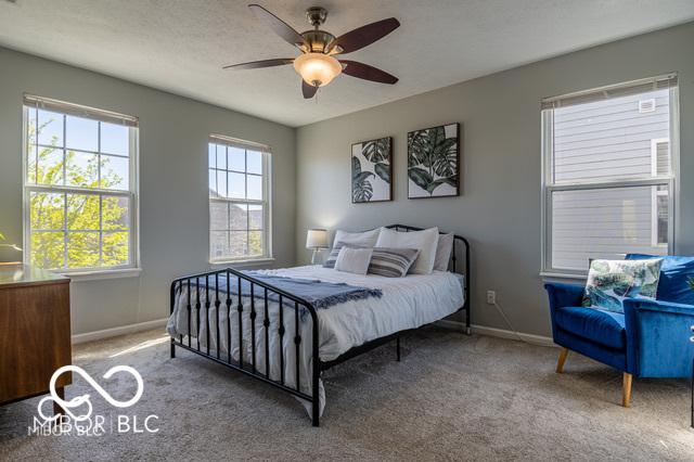 12584 Cold Stream Rd, Noblesville, IN 46060 - carpeted bedroom with baseboards and a ceiling fan