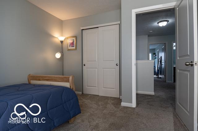 12584 Cold Stream Rd, Noblesville, IN 46060 - bedroom featuring dark carpet and a closet