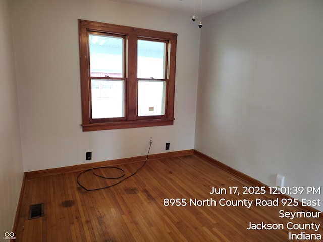 8955 N County Road 925 E, Seymour, IN 47274 - unfurnished room with hardwood / wood-style flooring and baseboards