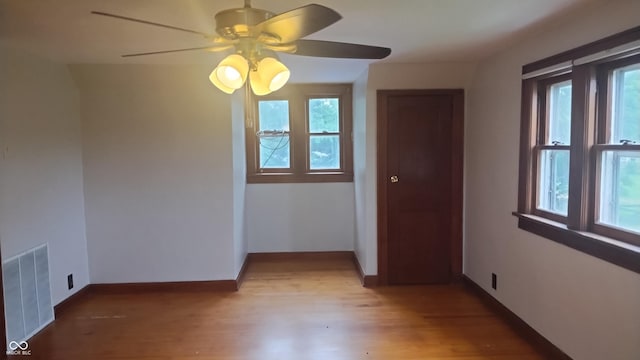 8955 N County Road 925 E, Seymour, IN 47274 - unfurnished room featuring healthy amount of natural light, ceiling fan, and light wood-style floors