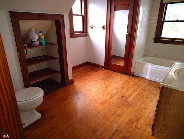 8955 N County Road 925 E, Seymour, IN 47274 - full bath with wood finished floors, vanity, and a garden tub