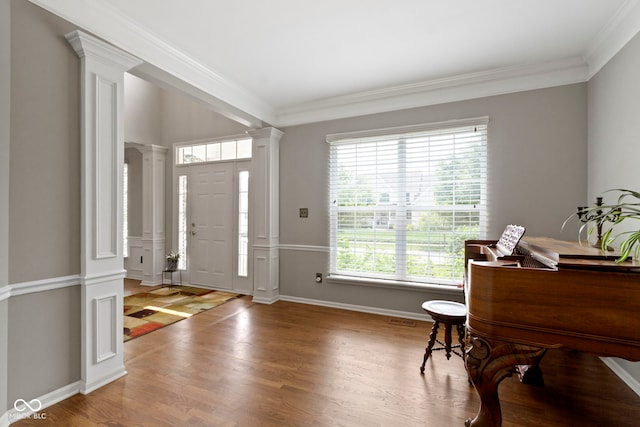 13624 Alston Dr, Fishers, IN 46037 - foyer entrance featuring ornate columns, ornamental molding, and wood finished floors