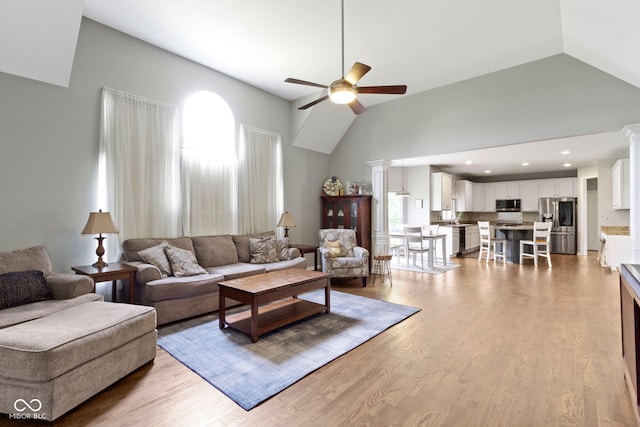 13624 Alston Dr, Fishers, IN 46037 - living area with a ceiling fan, wood finished floors, high vaulted ceiling, ornate columns, and recessed lighting