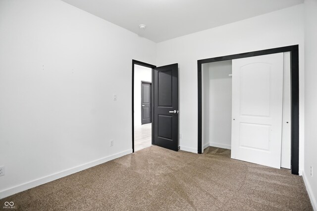 3210 Hovey St, Indianapolis, IN 46218 - unfurnished bedroom with carpet floors and a closet