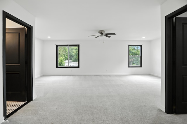 3210 Hovey St, Indianapolis, IN 46218 - spare room featuring carpet, a ceiling fan, and recessed lighting