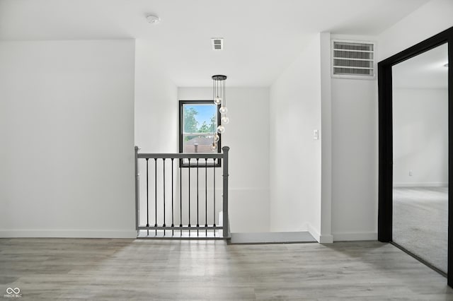 3210 Hovey St, Indianapolis, IN 46218 - hall featuring an upstairs landing and wood finished floors