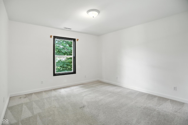 3210 Hovey St, Indianapolis, IN 46218 - carpeted empty room featuring baseboards