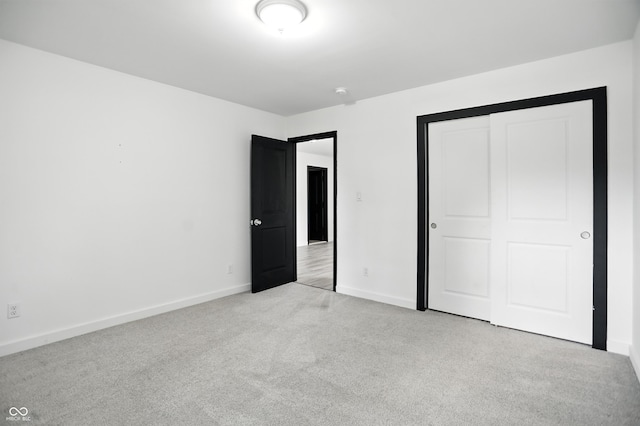 3210 Hovey St, Indianapolis, IN 46218 - unfurnished bedroom featuring carpet and a closet