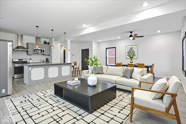 3210 Hovey St, Indianapolis, IN 46218 - living room with a ceiling fan, light wood-type flooring, and recessed lighting