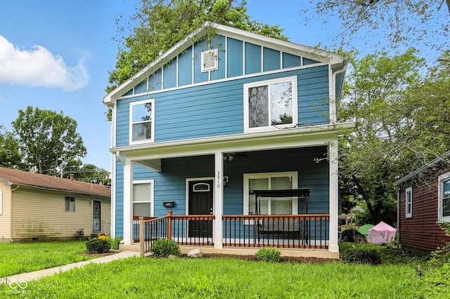 3210 Hovey St, Indianapolis, IN 46218 - view of front of property with board and batten siding and covered porch