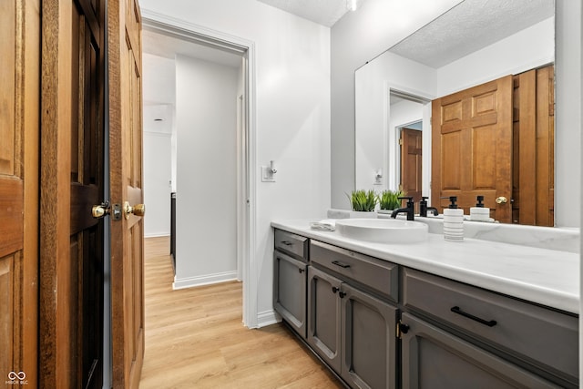 5982 Oak Hill E Dr, Plainfield, IN 46168 - bathroom featuring vanity, wood finished floors, and a textured ceiling