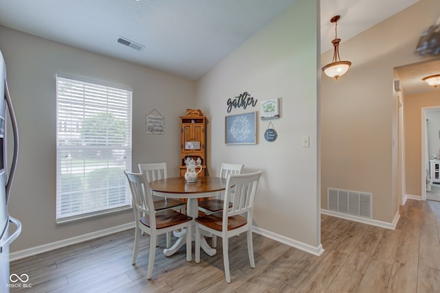 741 Chestnut Ln, Brownsburg, IN 46112 - dining area with light wood finished floors and vaulted ceiling