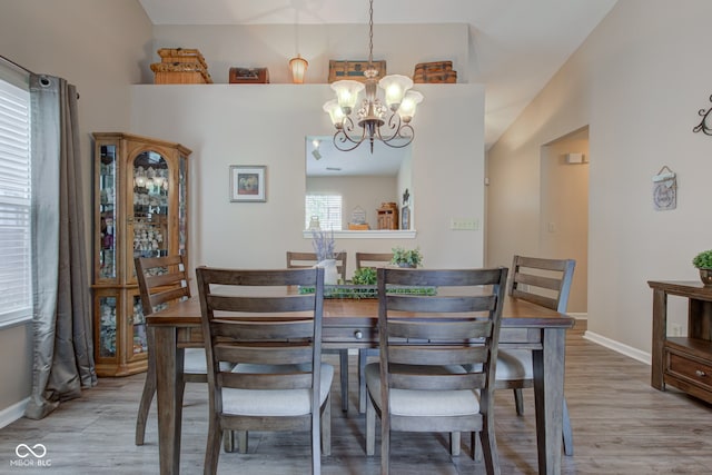 741 Chestnut Ln, Brownsburg, IN 46112 - dining room featuring a chandelier and light wood-style floors